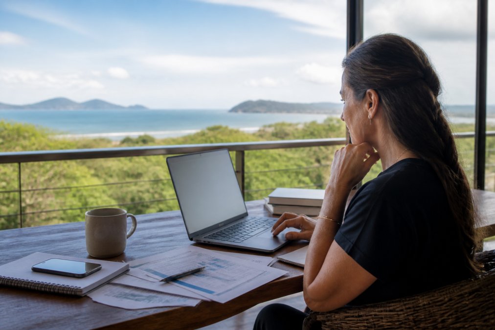 Property owner reviewing financial data for alternatives to traditional property management in Guanacaste